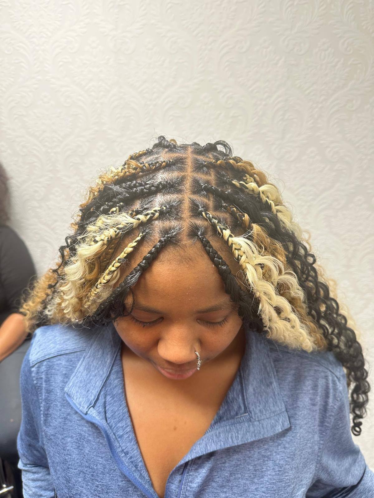 Boho braids with blonde highlight curls, front view