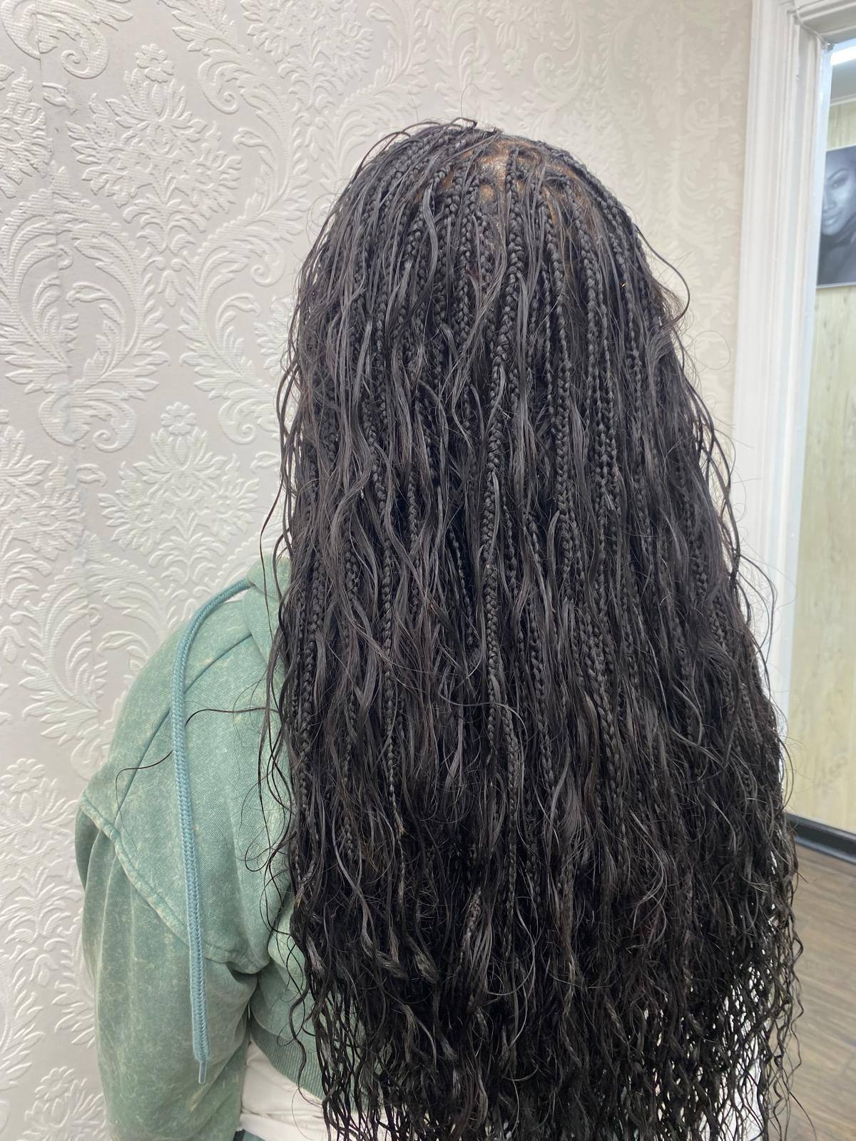 Long boho braids with loose curl accents