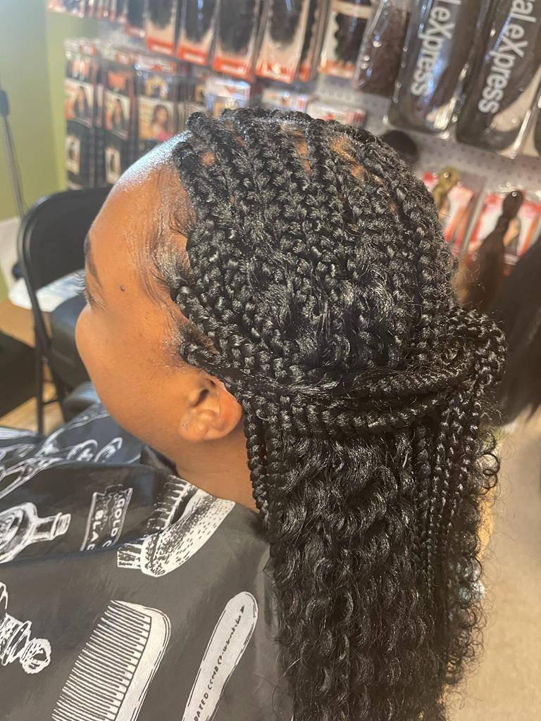 Knotless braids with curled tips, close side view