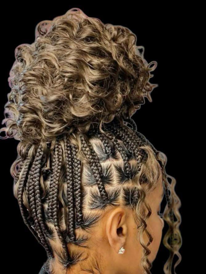 Braided updo finished with a blonde curly bun