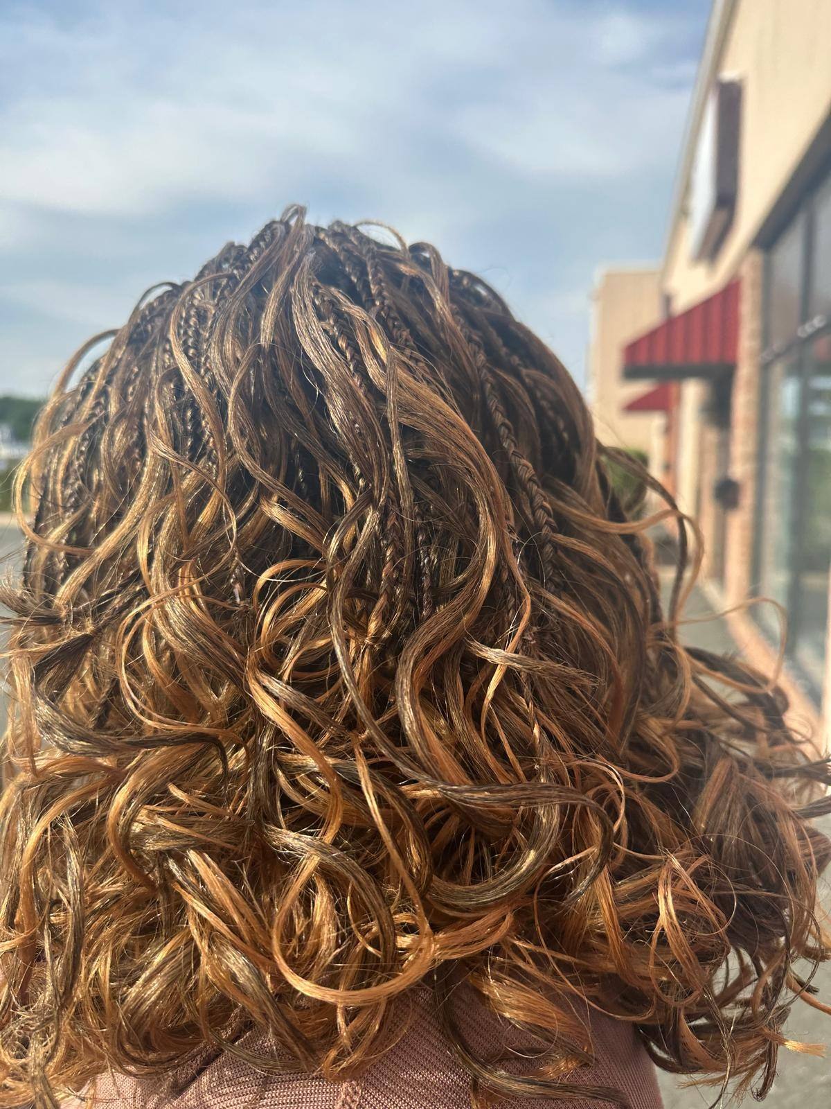 Copper crochet curls styled into a shoulder length bob