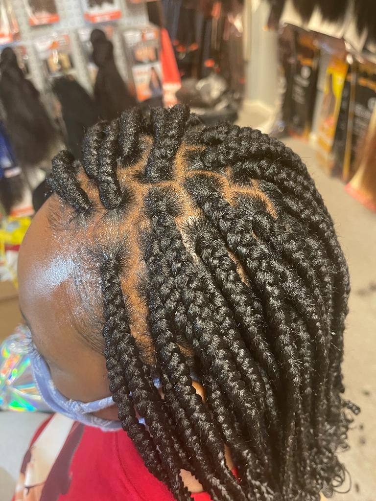 Feed-in cornrows showing tight, even scalp braiding