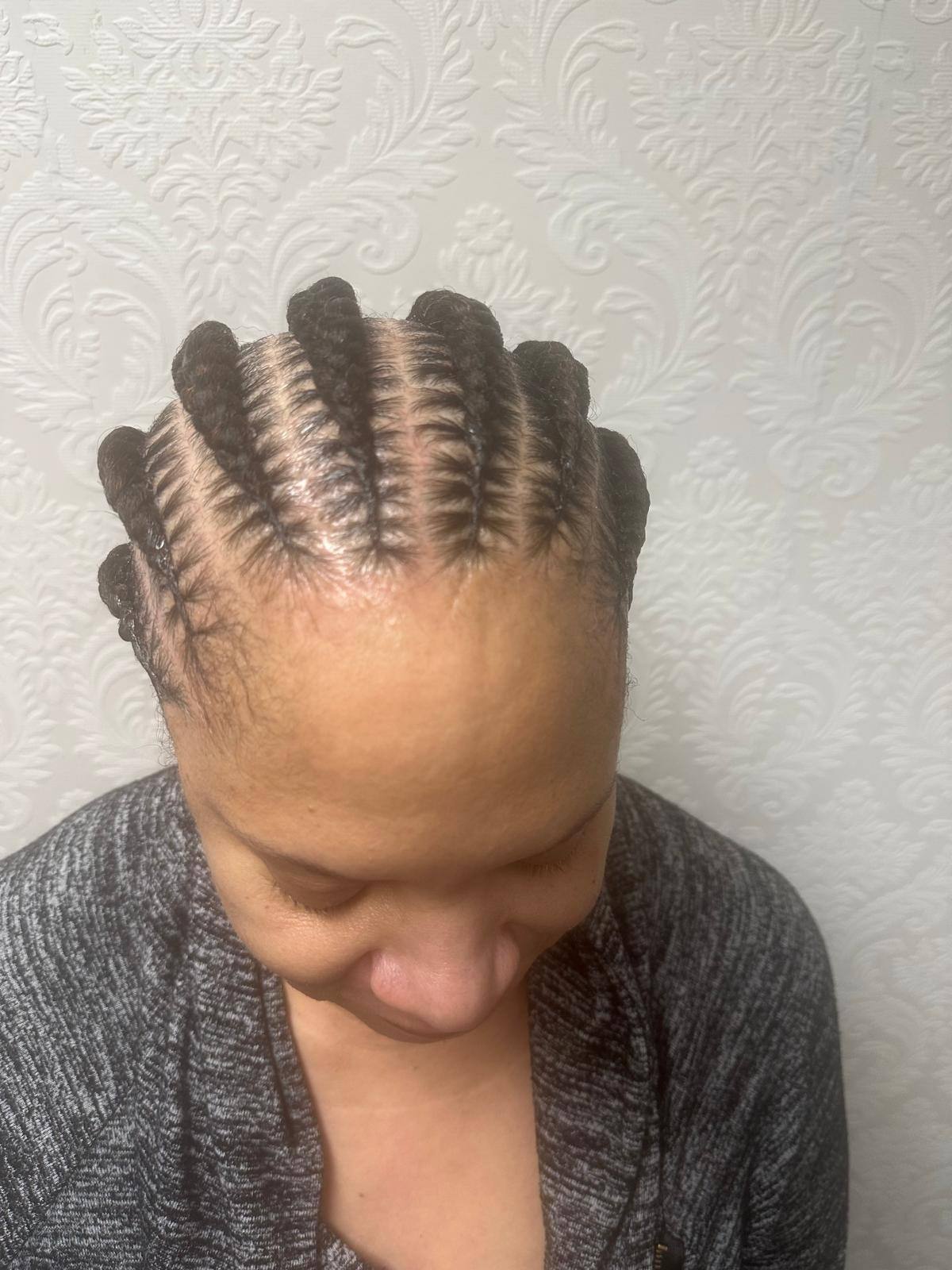 Feed-in cornrows braided straight back
