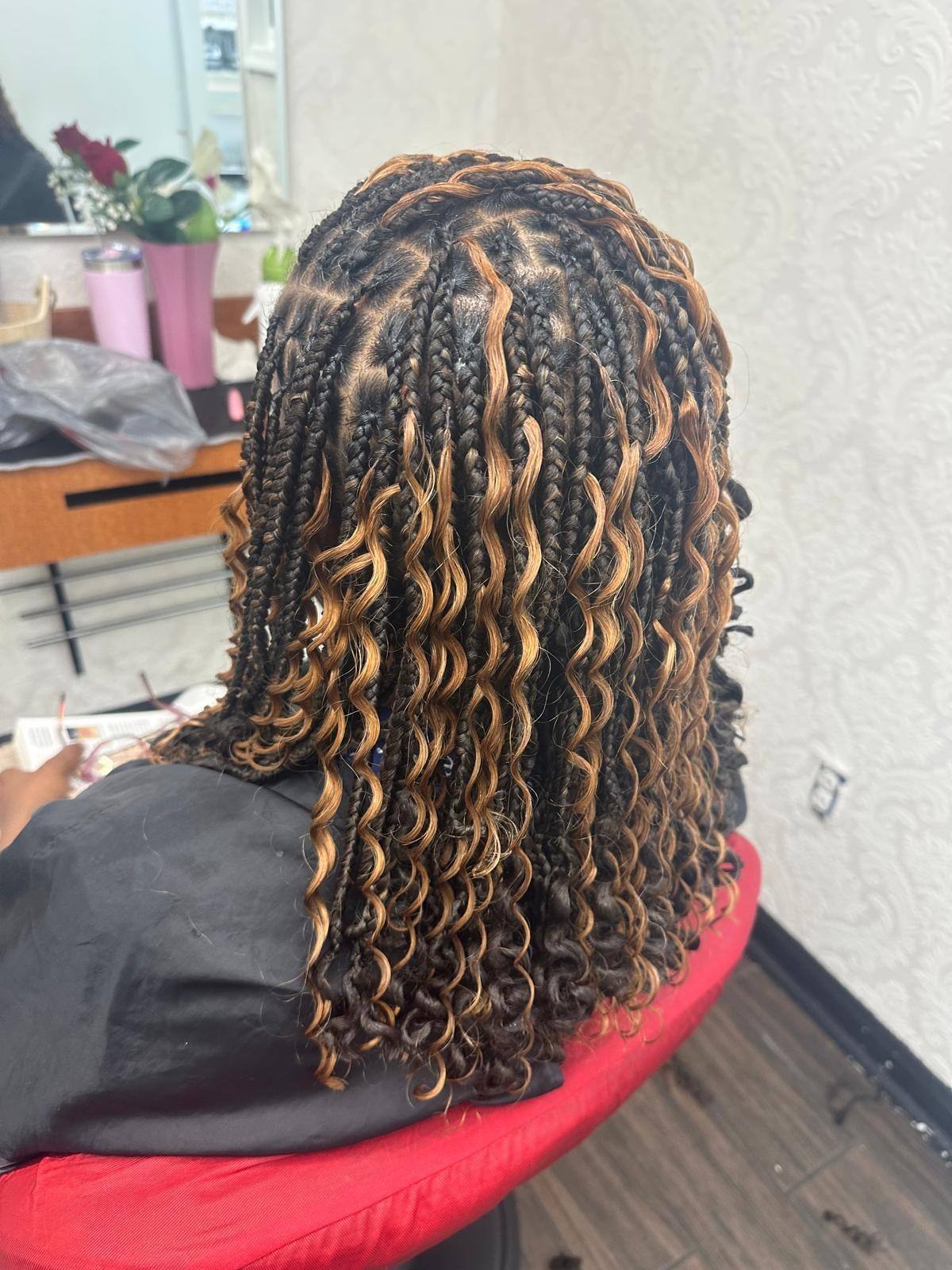 Honey curly twists viewed from behind in the salon