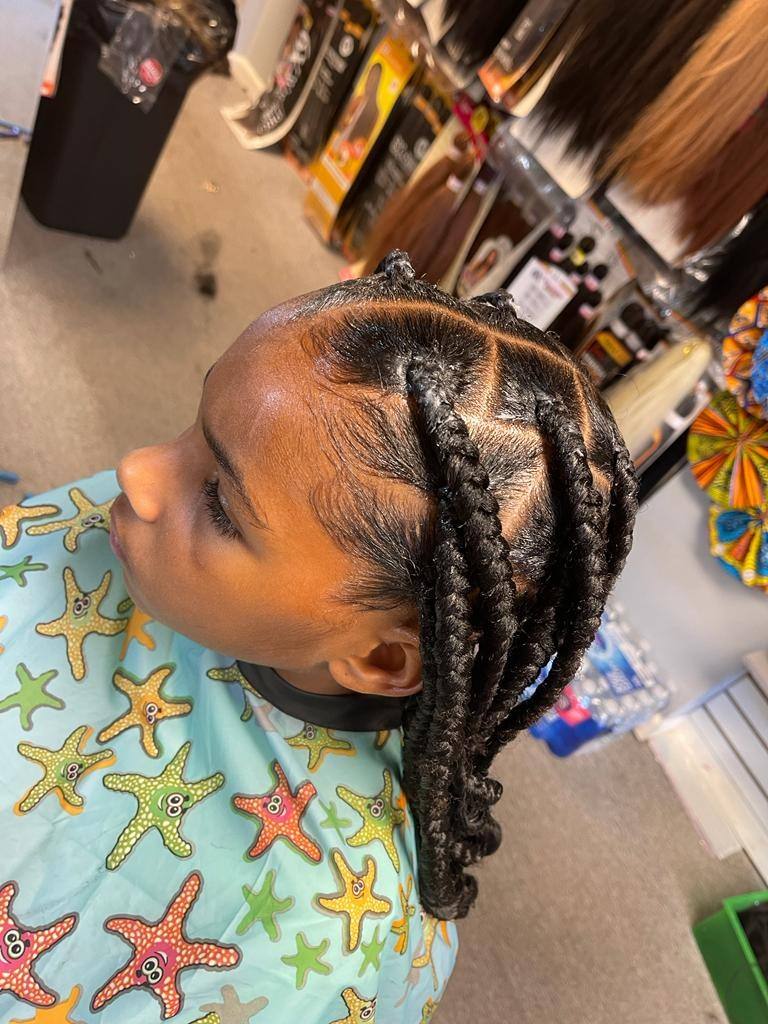 Child's braids styled in the salon, side view