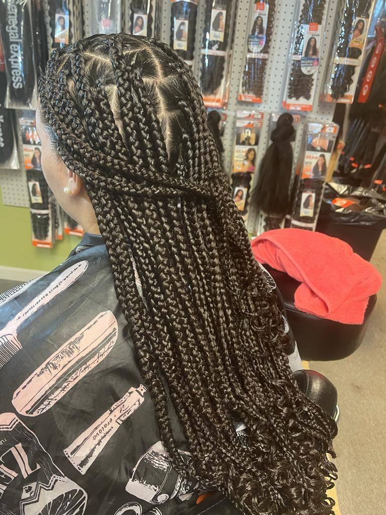 Medium knotless braids past the shoulder, side profile