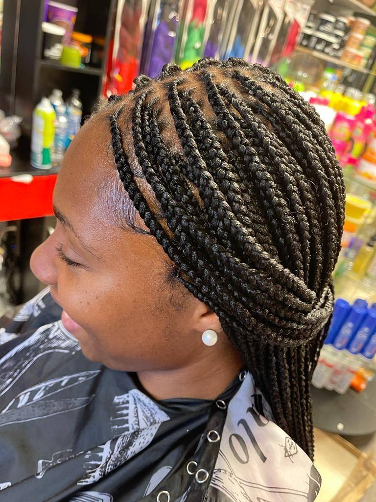 Small knotless braids, side profile with clean hairline