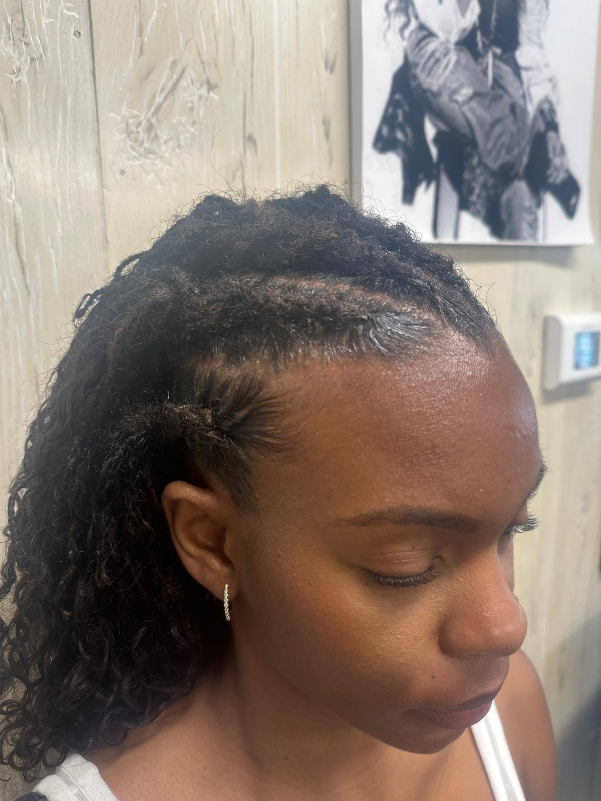 Natural hair prepped and parted before braiding