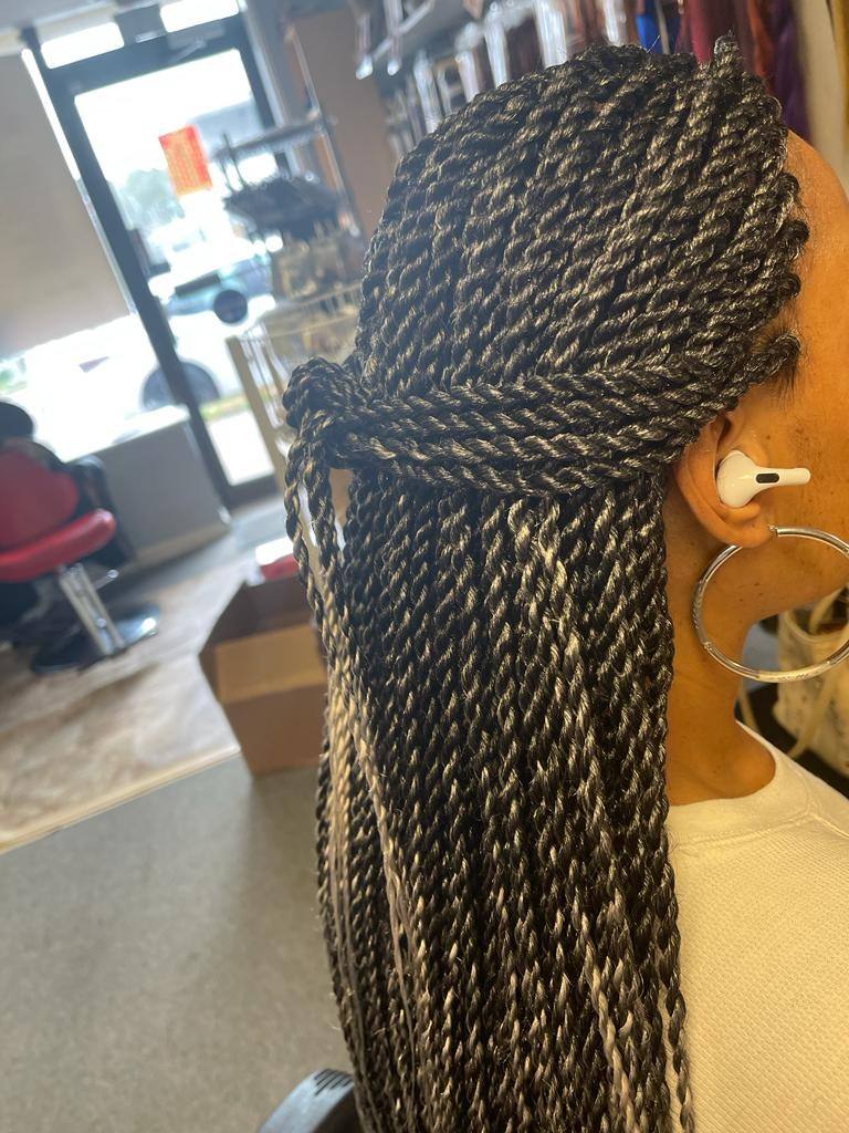 Senegalese twists styled long, side view