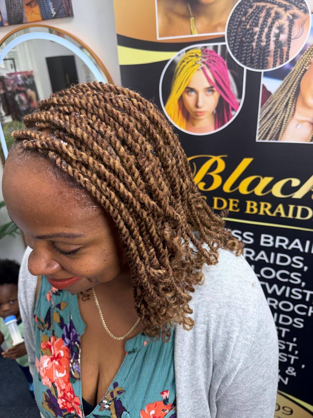 Short honey twists styled into a bob, in the salon