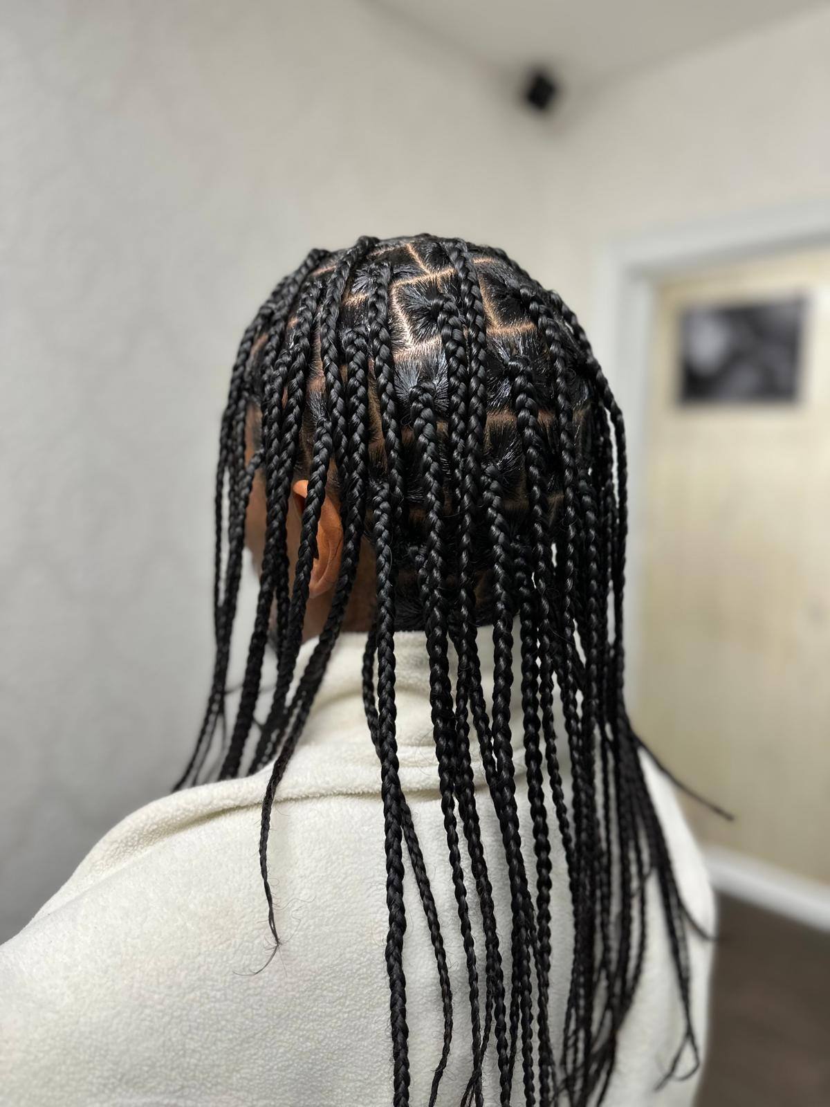 Small knotless braids with fine, even partings